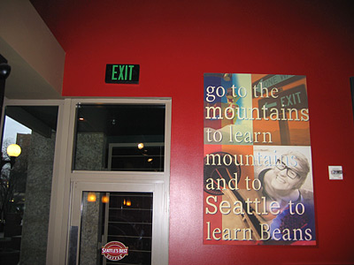 [poster: "go to the mountains to learn mountains and to Seattle to learn Beans"