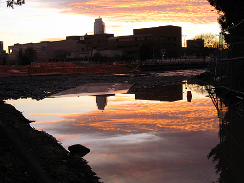 [Sunset reflected in puddle]